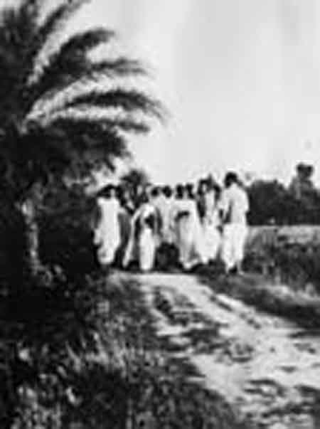 Gandhiji taking his Morning walk with Sachin Mitra and others.jpg